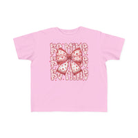 Be Mine Toddler Tee featuring a central ribbon-style bow with red hearts and BE MINE in heart-patterned letters, crafted for toddler comfort and durability.