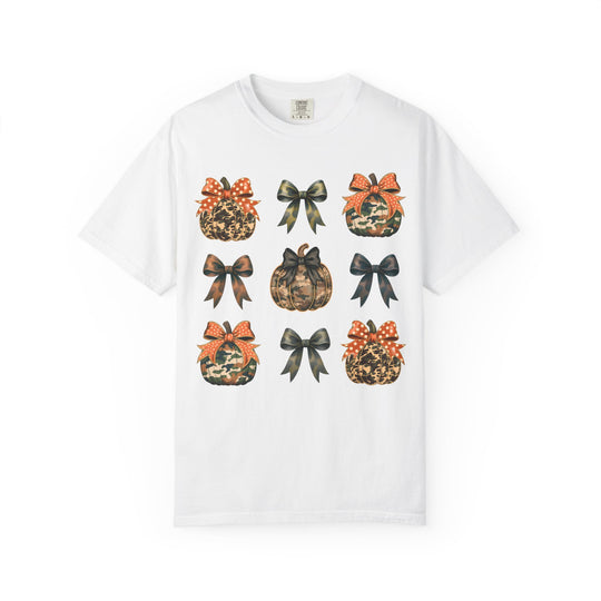 Bows and Pumpkins Tee features a 3x3 grid with camo and animal-print pumpkins, alternating with matching bows, on a soft, durable white T-shirt.