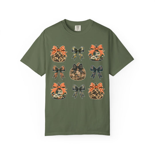 Bows and Pumpkins Tee: Olive-green short-sleeve T-shirt with a grid of fall-themed camo and animal-print pumpkins, and bows. Crafted from soft, durable 100% ring-spun cotton.