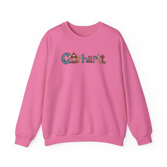 A pink Cowhartt Crew sweatshirt featuring a cartoon cow logo. Unisex heavy blend fabric with ribbed knit collar, no itchy seams. 50% cotton, 50% polyester, loose fit, true to size.