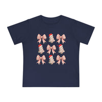 Cookies and Bows Baby Tee: Navy-blue tee with festive grid of candy-cane bows, Christmas trees in Santa hats, sprinkled with red and green stars.