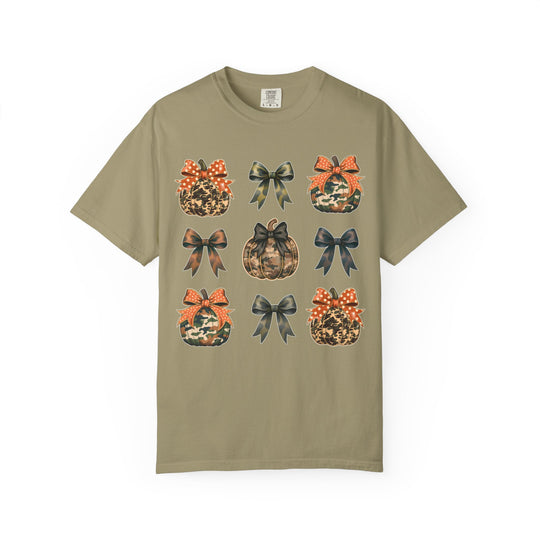 Bows and Pumpkins Tee: Olive-green shirt featuring a 3×3 grid with pumpkin and bow icons, blending camouflage and leopard patterns, ideal for casual wear.