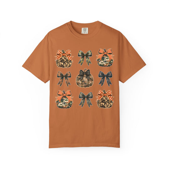 Bows and Pumpkins Tee features a 3x3 grid of camo and leopard-print pumpkins with coordinating bows on a burnt-orange Comfort Colors T-shirt.