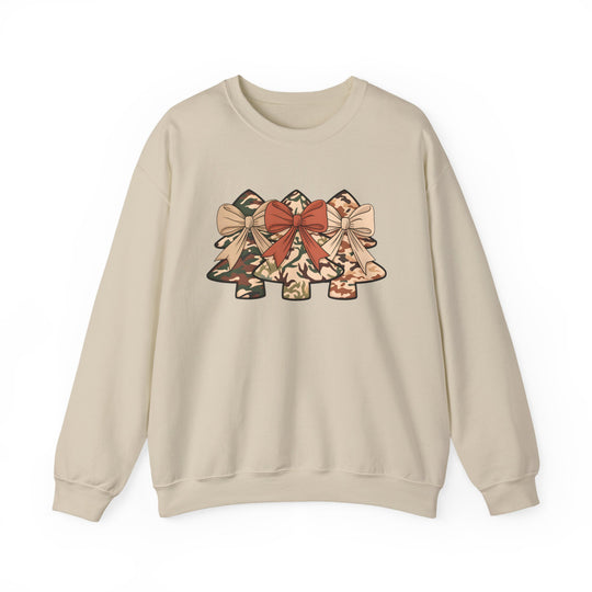 Cream crew-neck sweatshirt with camo Christmas trees graphic, each adorned with bows. Made from polyester-cotton blend for comfort and durability. Ideal for festive occasions.