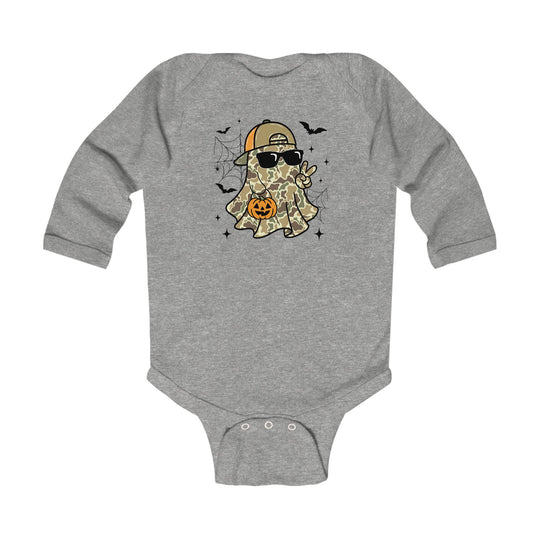 Candy Ghost Long Sleeve Onesie features a camo-patterned ghost graphic with sunglasses and cap, holding a candy bucket, surrounded by bats and spider webs.