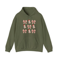 Cookies and Bows Hoodie featuring a festive grid of red bows and Christmas trees, showcased flat with kangaroo pocket and drawstring hood, ideal for cozy holiday wear.