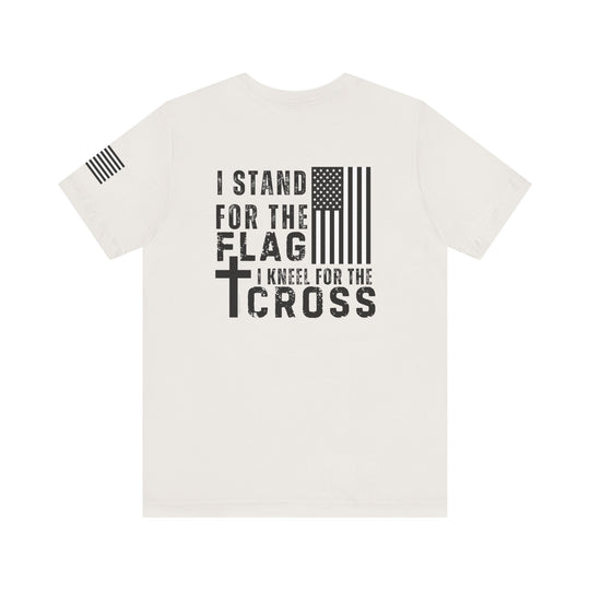 Unisex jersey tee with black text and flag design. 100% cotton, ribbed knit collar, tear away label. Retail fit, true to size. Ideal for those who Stand for Flag Kneel for Cross.