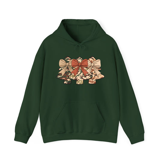 Camo Christmas Tree Hoodie featuring stylized camouflage trees with ribbon bows on a dark green pullover. Includes kangaroo pocket and drawstring hood, ideal for festive, casual wear.