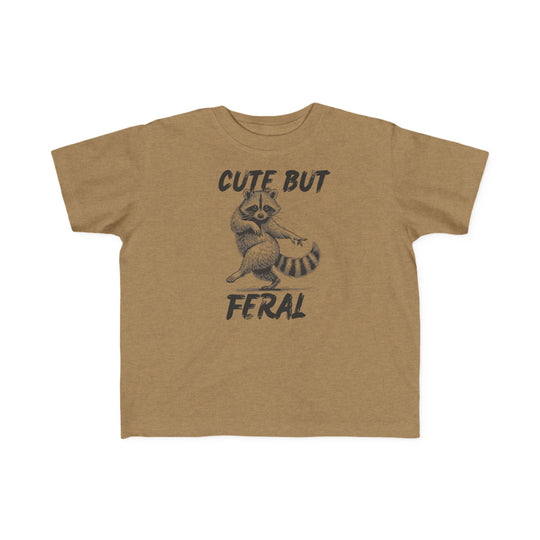 Cute but Feral Toddler Tee featuring a playful raccoon graphic, crafted from soft, durable cotton, perfect for toddlers' comfort and first adventures.