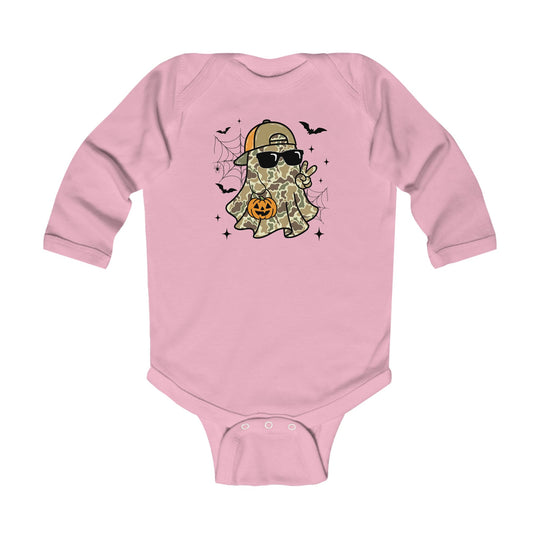 Candy Ghost Long Sleeve Onesie featuring a cartoon ghost with camouflage, sunglasses, and cap, holding a jack-o’-lantern, amidst spider-webs, bats, and sparkles.