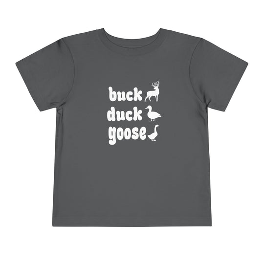 Buck, Duck, Goose Toddler Tee features playful animal silhouettes and text on a dark-gray T-shirt, adding humor to a classic children's game theme.