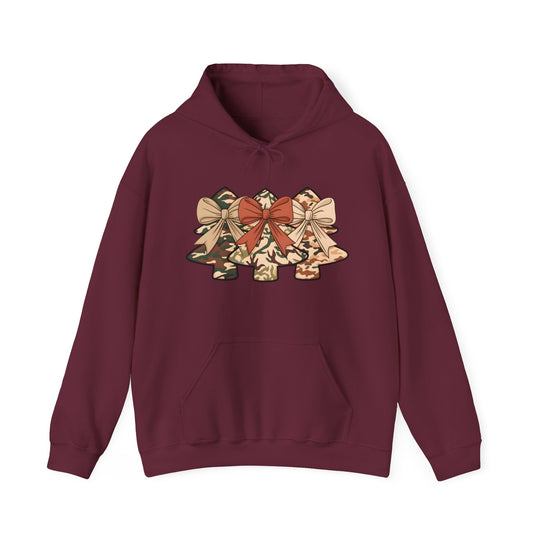 Maroon hoodie featuring three camo Christmas trees with bows, combining comfort and style in a cotton-polyester blend, perfect for festive, unique fashion.