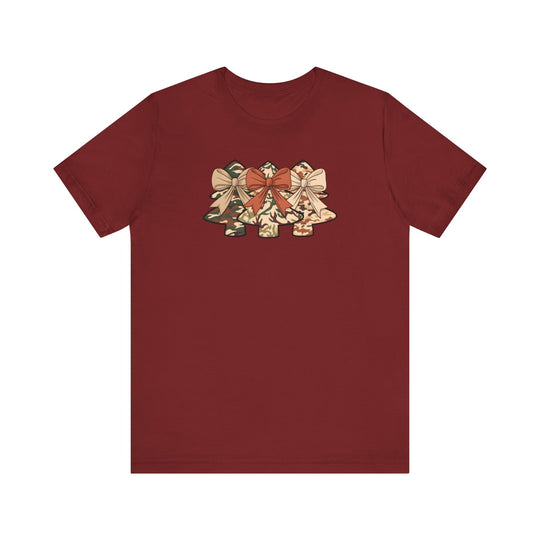 Camo Christmas Tree Tee: Maroon T-shirt featuring three camo-patterned Christmas trees with bows, made of soft cotton for a comfortable, lasting fit.