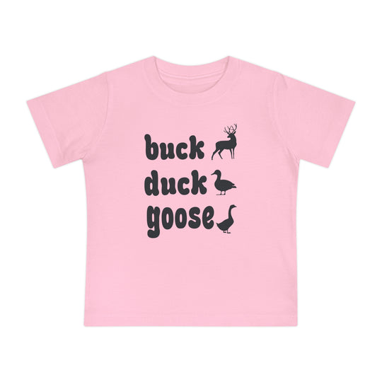 Buck, Duck, Goose Baby Tee features playful animal silhouettes alongside bold text on a light-pink T-shirt, offering a unique twist on a classic game.