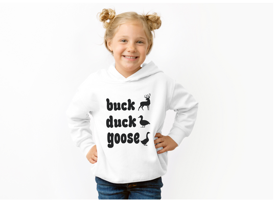 Young girl wearing a Buck, Duck, Goose toddler hoodie, featuring animal silhouettes, smiling with hands on hips, styled for comfort and durability with side-seam pockets.