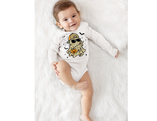 Baby wearing Candy Ghost Long Sleeve Onesie featuring a camouflage ghost with cap, sunglasses, peace sign, and jack-o’-lantern, designed for comfort and durability.