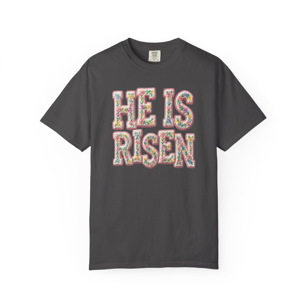 Charcoal T-shirt with HE IS RISEN in pastel floral embroidery pattern, reflecting Faith Family Designs' unique and inspirational style.