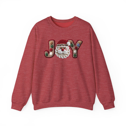 Red crew-neck sweatshirt with JOY motif; J and Y resemble holiday cookies, O is a Santa-face. Cozy polyester-cotton blend, ribbed collar, classic fit.