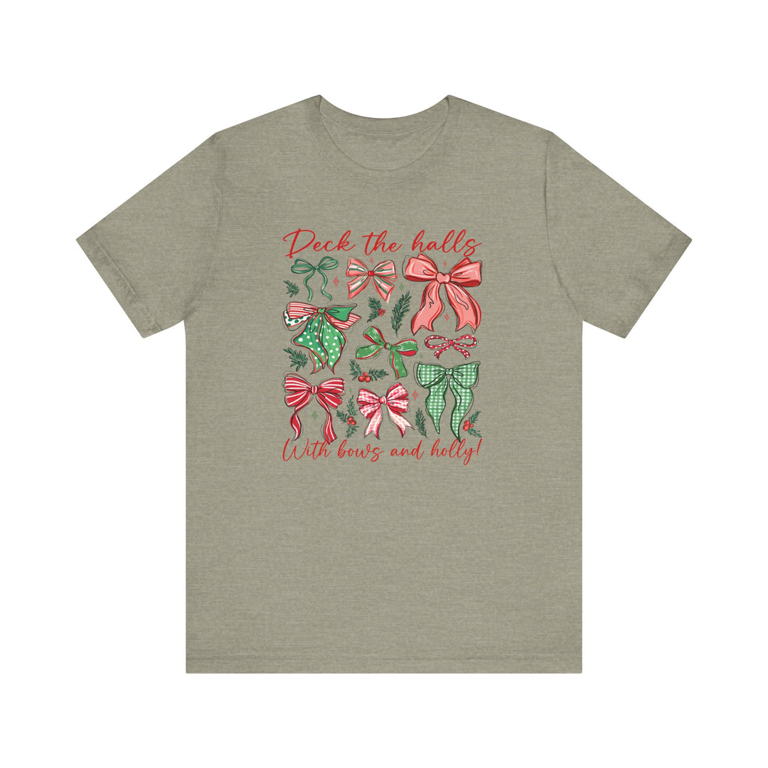 Deck the Halls Tee featuring festive red-and-green bow graphics and holly sprigs on an olive-green t-shirt. Soft cotton, unisex, comfortable fit.