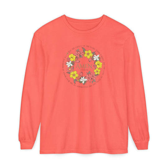 Coral-pink long-sleeve tee with floral wreath design, featuring AMEN and 2 Cor 13:14 verse text, made of 100% ring-spun cotton.