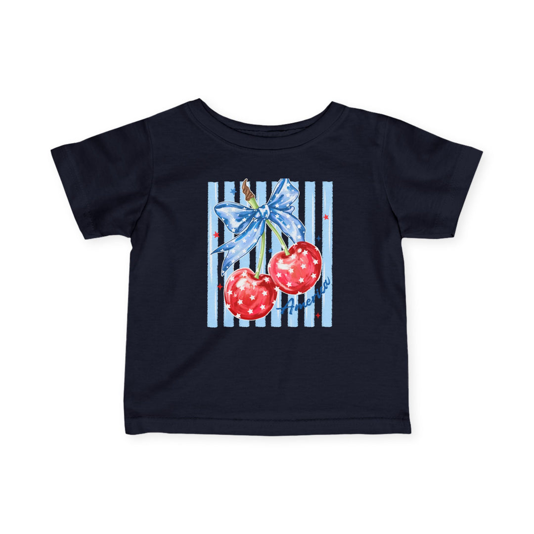American Cherry Baby Tee: Navy-blue toddler T-shirt featuring red cherries with a star-patterned bow and America script, designed for comfort and durability.