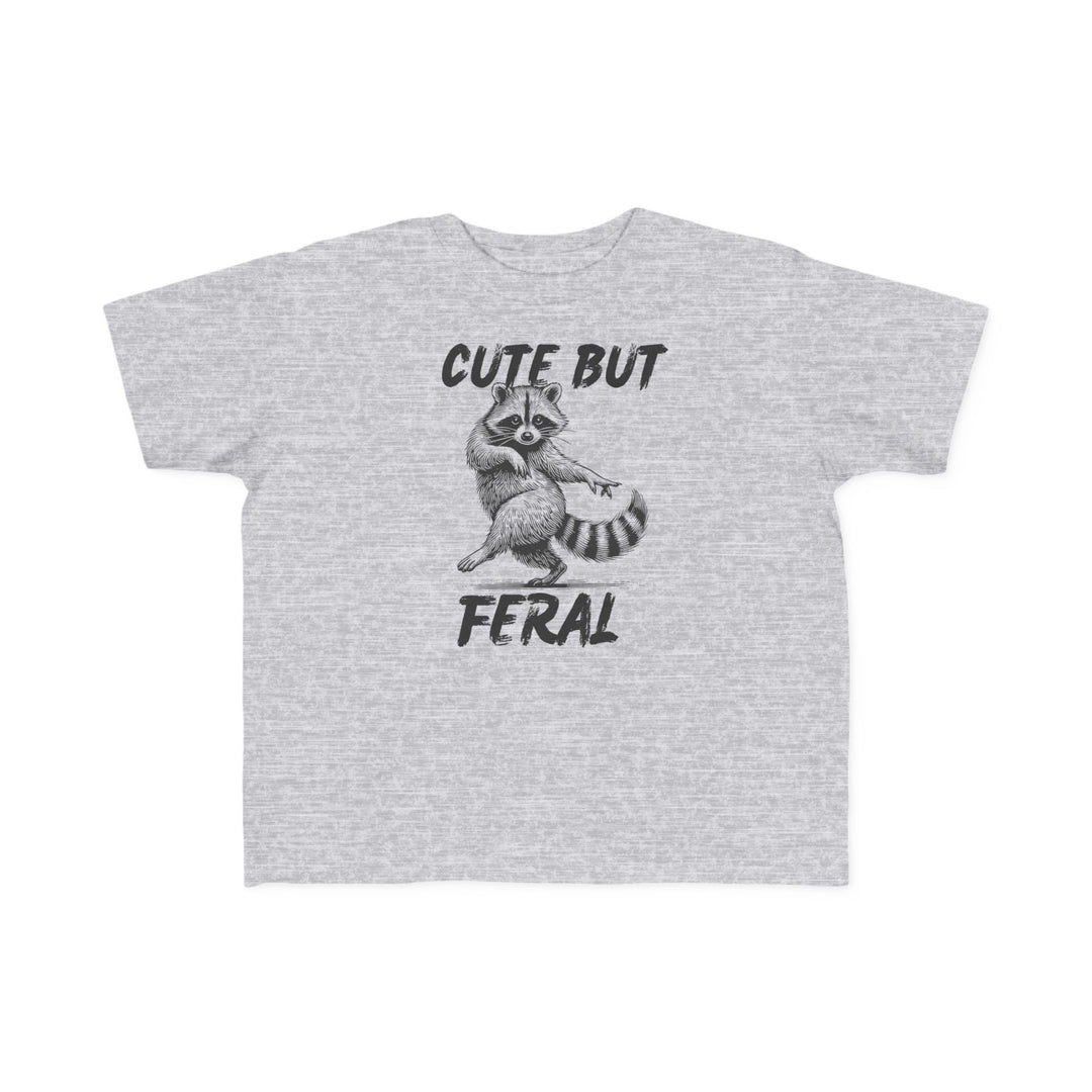 Cute but Feral Toddler Tee featuring a playful raccoon sketch with bold text, perfect for toddlers with soft cotton fabric and durable print.
