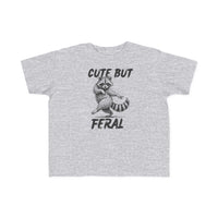 Cute but Feral Toddler Tee featuring a playful raccoon sketch with bold text, perfect for toddlers with soft cotton fabric and durable print.