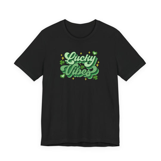Good Day Lucky Day Tee: Black T-shirt with 'Lucky Vibes' graphic, featuring shamrocks, hearts, and sparkles for a festive St. Patrick’s Day look.