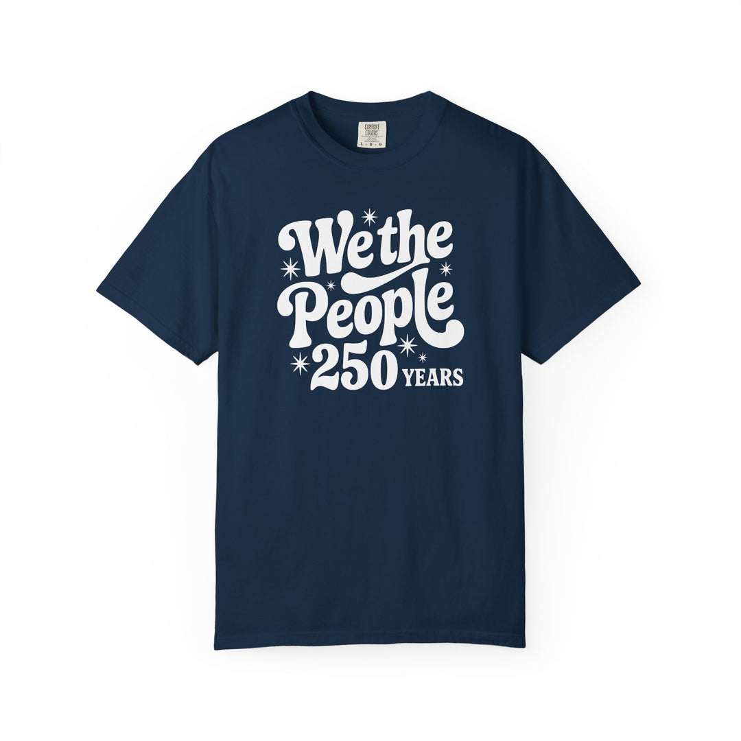 Navy-blue Comfort Colors T-shirt featuring We the People in retro-style white lettering with 250 Years and starburst accents, showcasing a relaxed fit for everyday wear.