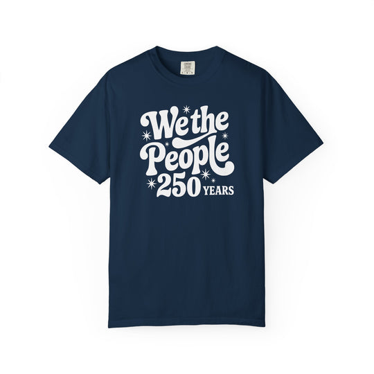 Navy-blue Comfort Colors T-shirt featuring We the People in retro-style white lettering with 250 Years and starburst accents, showcasing a relaxed fit for everyday wear.