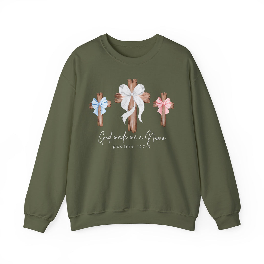 Olive-green sweatshirt with rustic wooden crosses and 'God Made Me a Nana' text, blending comfort and faith-based design from Faith Family Designs.
