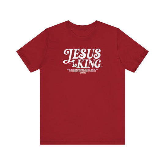 Jesus is King Tee featuring white text on a soft red fabric, classic unisex fit with ribbed knit collars, perfect for a comfortable, stylish look.