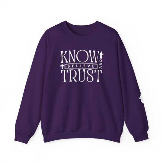 Trust, Know, Believe Crew: Purple unisex sweatshirt with white text, featuring a classic fit, crew neckline, ribbed collar, and durable stitching.