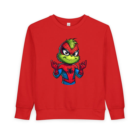 Toddler crewneck sweatshirt featuring the Grinch in a Spider-Man suit, showcasing a playful design with web-shooting gesture. Made from a cozy cotton-polyester blend.