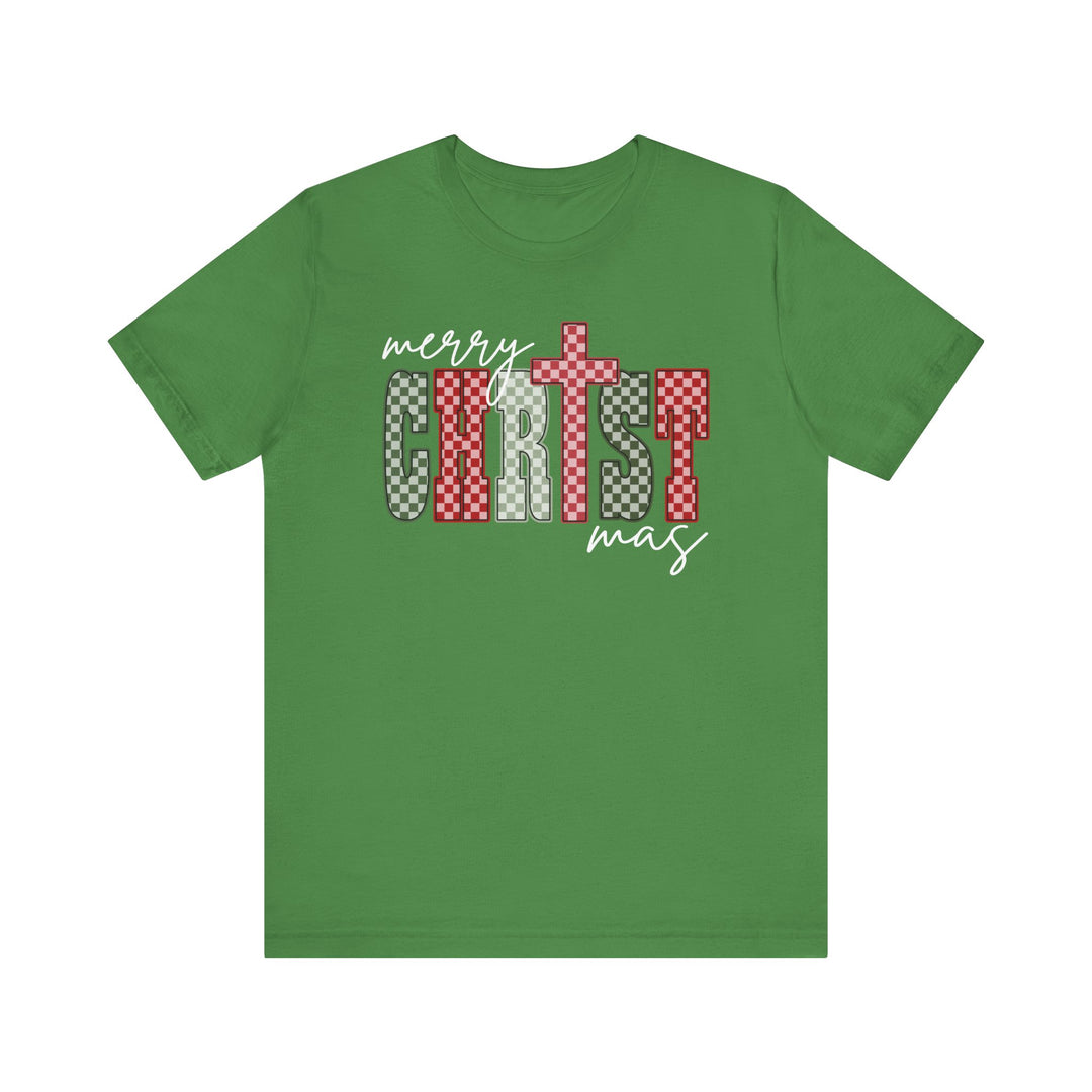 Christmas Tee featuring Merry Christmas graphic with checker-patterned CHRIST and cross-shaped T on a green background, highlighting festive spirit and soft comfort.