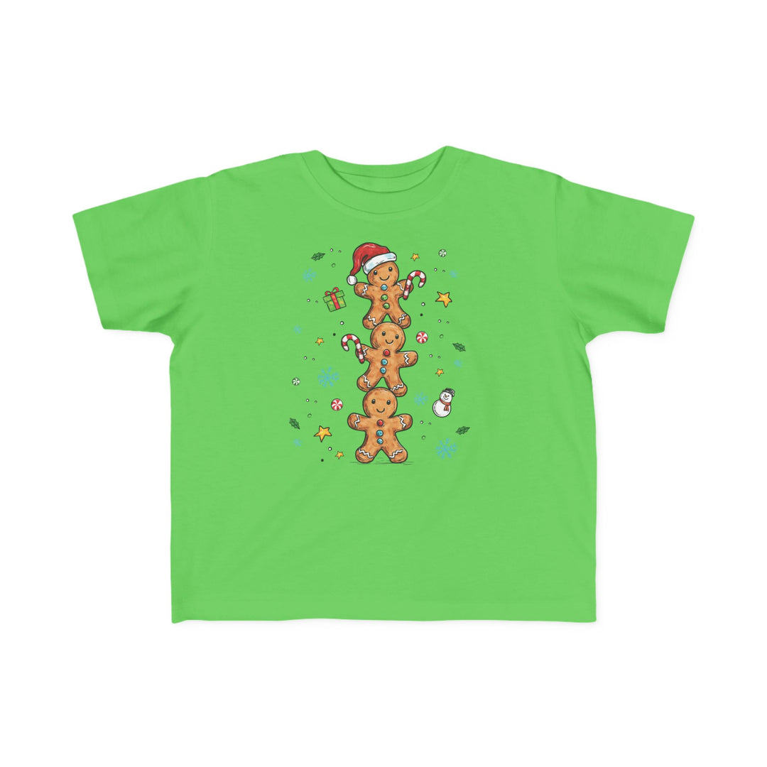 Gingerbread Stack Toddler Tee features cartoon gingerbread men and festive accents, perfect for toddlers' adventures. Soft, durable, and ideal for sensitive skin.