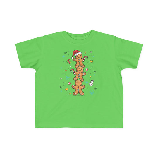 Gingerbread Stack Toddler Tee features cartoon gingerbread men and festive accents, perfect for toddlers' adventures. Soft, durable, and ideal for sensitive skin.