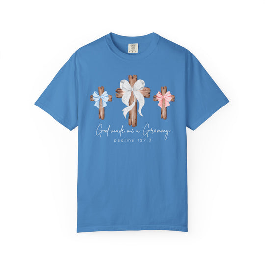 Sky-blue tee with three wooden crosses and bows, God made me a Grammy script, featuring Comfort Colors' relaxed fit and durable cotton.