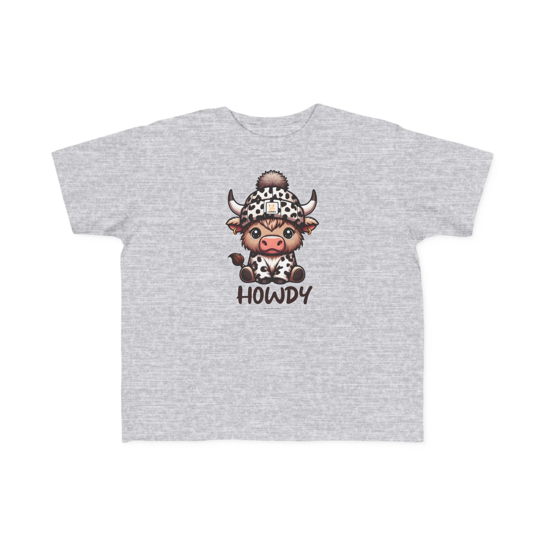 Toddler tee featuring a cartoon cow in a hat, ideal for sensitive skin. 100% combed ringspun cotton, light fabric, tear-away label, classic fit. Sizes: 2T, 3T, 4T, 5-6T. Howdy Toddler Tee by Worlds Worst Tees.