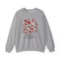 Love Never Fails Crew sweatshirt features heart-shaped blooms and Love never fails text, combining comfort with meaningful design, ideal for all occasions.
