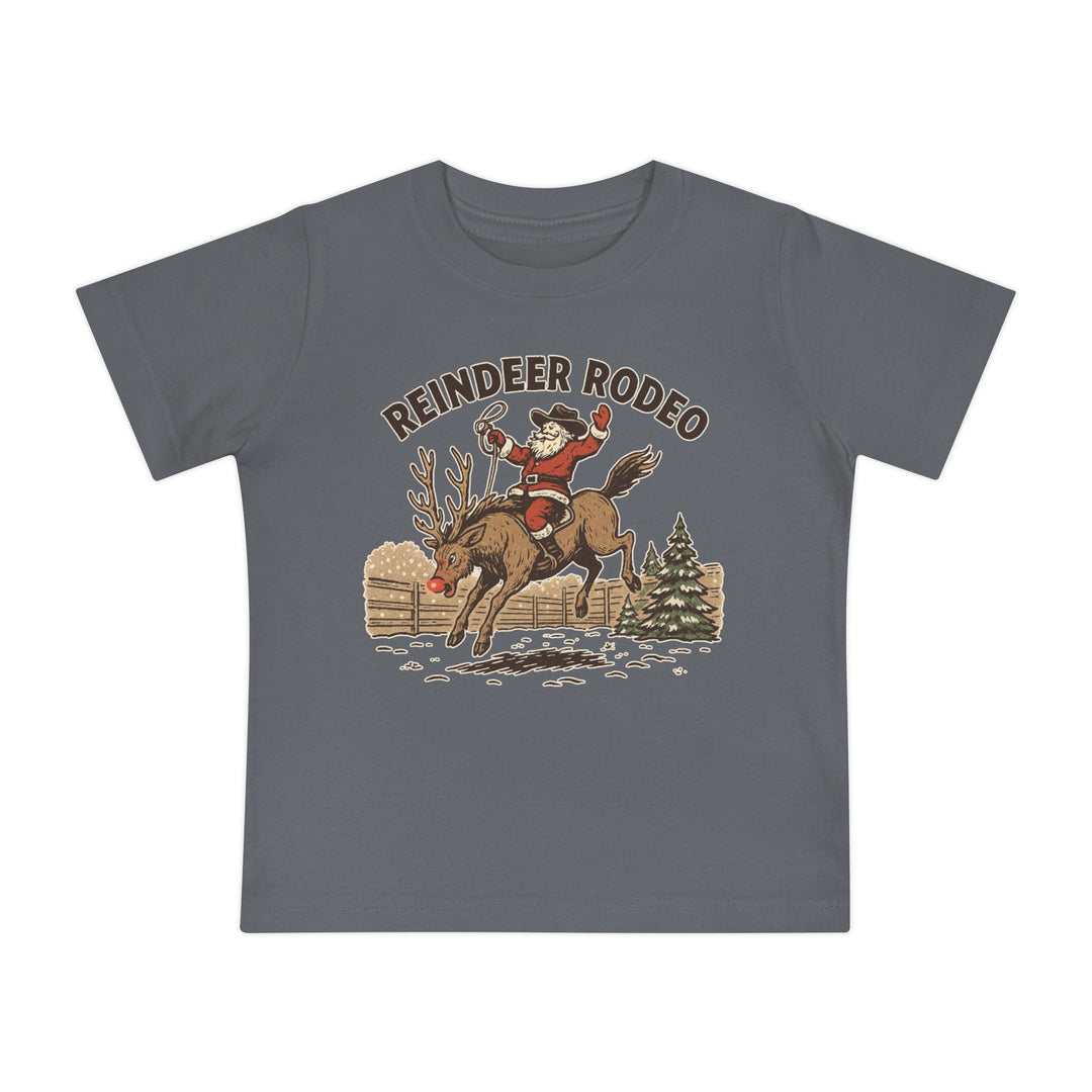 Reindeer Rodeo Baby Tee featuring Santa in cowboy gear on Rudolph, perfect for baby’s style and comfort with shrink-resistant, soft cotton blend.