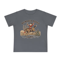 Reindeer Rodeo Baby Tee featuring Santa in cowboy gear on Rudolph, perfect for baby’s style and comfort with shrink-resistant, soft cotton blend.