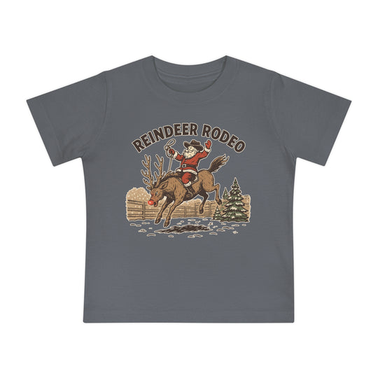 Reindeer Rodeo Baby Tee featuring Santa in cowboy gear on Rudolph, perfect for baby’s style and comfort with shrink-resistant, soft cotton blend.