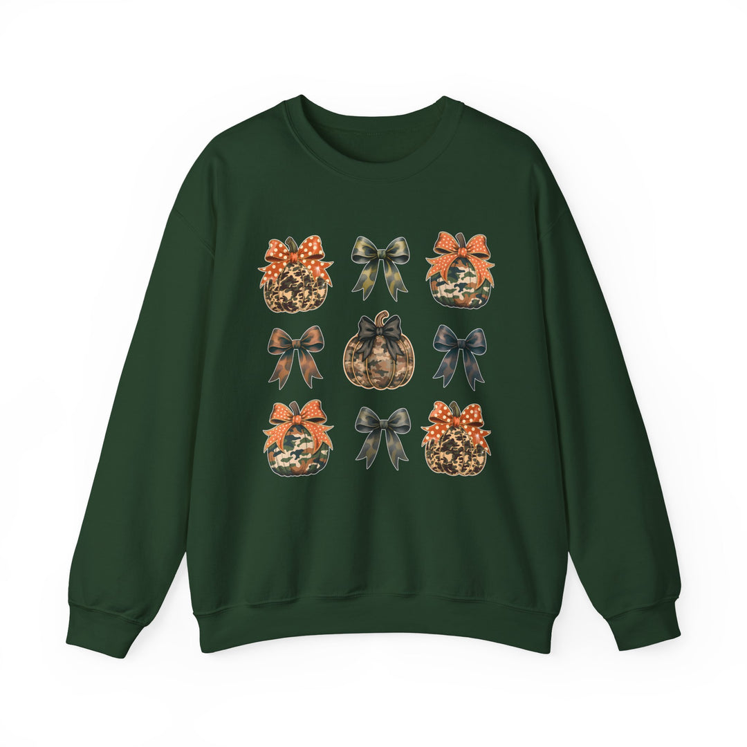 Dark-green crewneck sweatshirt with a 3×3 grid of camo-style pumpkins and decorative bows, embodying a cozy, fall-themed design.