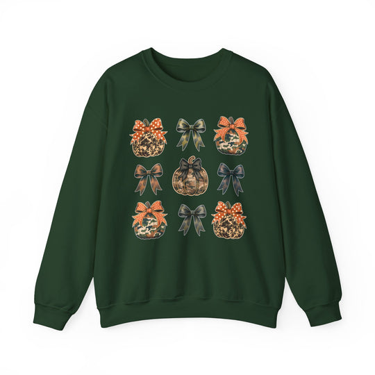 Dark-green crewneck sweatshirt with a 3×3 grid of camo-style pumpkins and decorative bows, embodying a cozy, fall-themed design.
