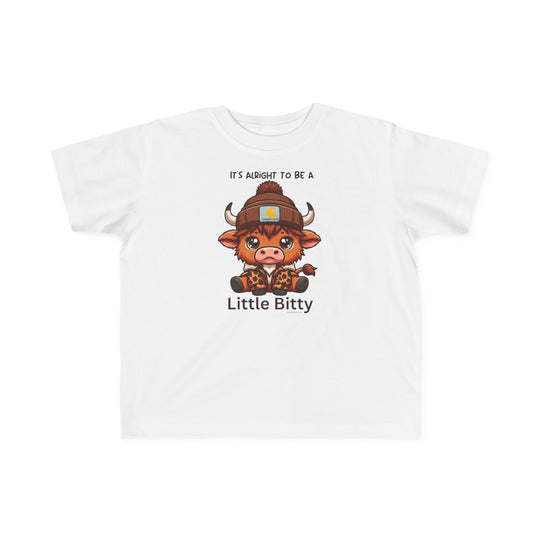 A Little Bitty Toddler Tee featuring a cartoon cow design on white fabric. Made of soft 100% combed ringspun cotton, light and durable for sensitive skin. Classic fit with tear-away label.