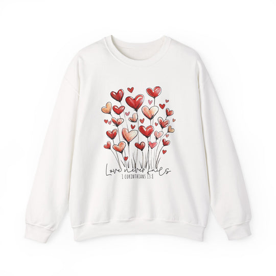Love Never Fails Crew sweatshirt featuring red-and-pink heart designs with Love never fails text, offering a comfortable, loose fit with durable polyester-cotton blend.