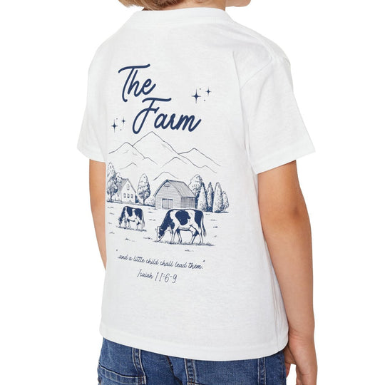 The Farm Toddler T-shirt features a farm scene illustration and Bible quote on a soft, eco-friendly cotton tee, perfect for stylish, comfortable wear.