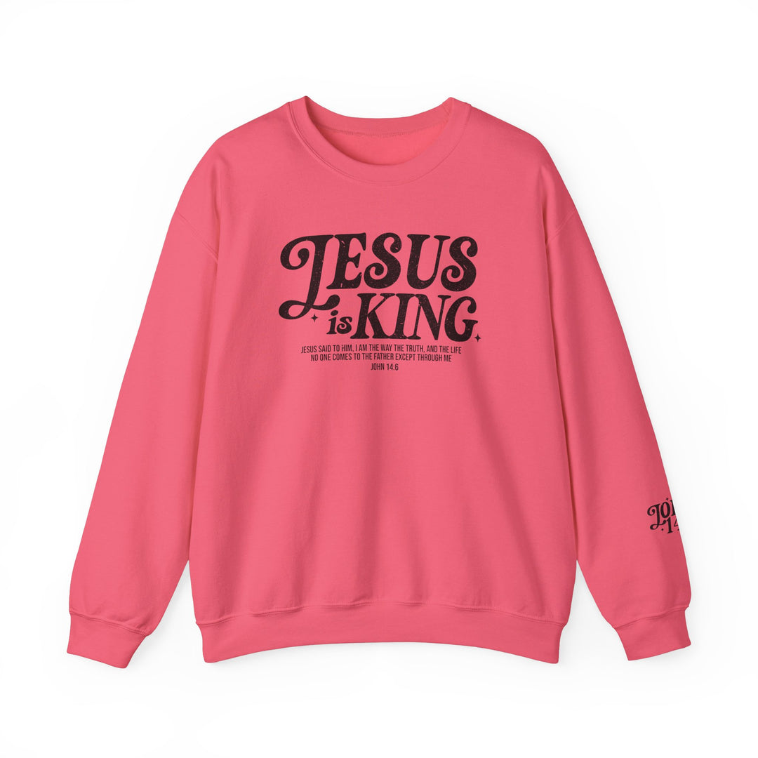 Jesus is King Crew pink sweatshirt featuring black text, made of cotton and polyester blend for comfort and durability, available in multiple sizes.