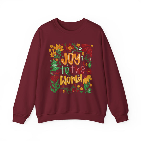 Maroon crew-neck sweatshirt with Joy to the World in festive colors, surrounded by holiday-themed doodles; cozy, durable fabric blend for colder months.